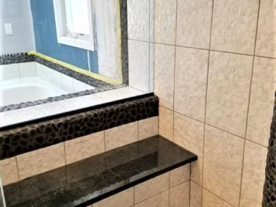 Bathtub Renovation and Pebble-Style Flooring Tiles Installation